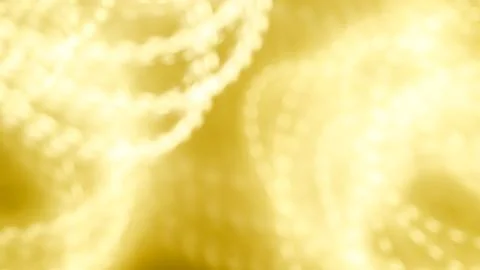 Abstract golden light patterns with soft bokeh effect for design projects Stock Photos