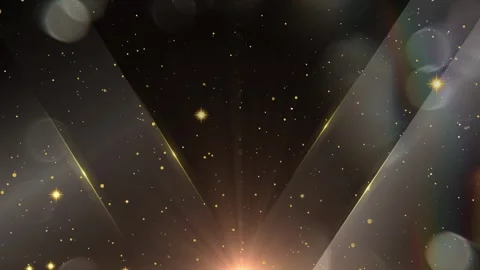 Abstract golden light rays and shimmering particles floating in dark atmosphere 스톡 동영상 345103351