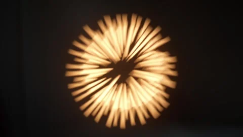 Abstract Golden Light Rays Pulsing in Circular Motion on Black Background 스톡 동영상 334136214