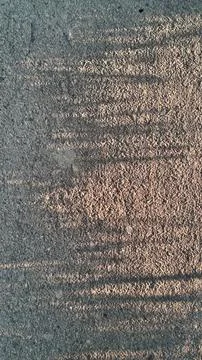 Abstract golden light reflection on dark rippled water surface texture Fotos de archivo