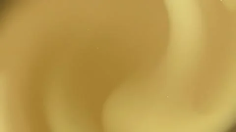 Abstract golden liquid background with soft flow effect and warm glowing li.. Stock Photos