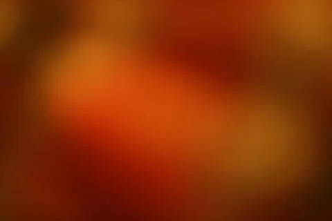 Abstract gradient background with warm tones suggesting autumn foliage and .. Stock Photos