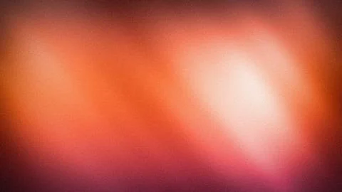 Abstract grainy 4K background with vibrant orange red and peach warm light bl Stock Illustration