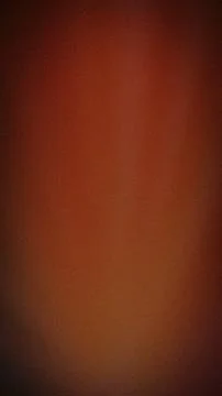 Abstract grainy background with deep red, terracotta, burgundy, and dark br.. Stock Photos