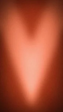 Abstract grainy background featuring a vertical gradient of copper, terraco.. Stock Photos