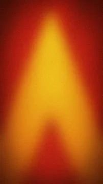 Abstract grainy background featuring a vertical gradient of vibrant red, or.. Stock Photos