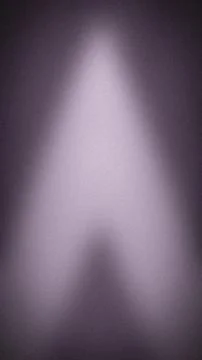 Abstract grainy background with a vertical gradient of dark purple, lavende.. Stock Photos