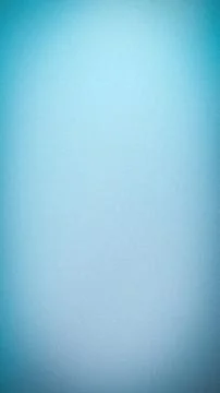 Abstract grainy blue gradient background with soft cyan highlights and nois.. Stock Photos