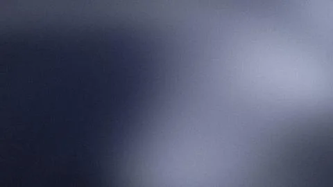 Abstract grainy blue gradient background with dark navy and light gray shad.. Stock Photos