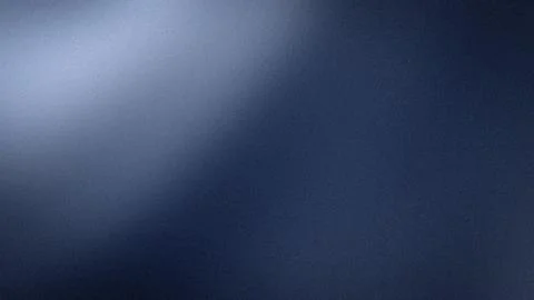 Abstract grainy blue gradient background 4K wallpaper with blurred dark nav.. Stock Photos