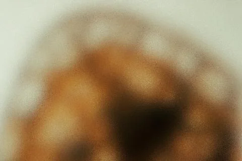 Abstract grainy bokeh texture in brown and golden tones Stock Photos