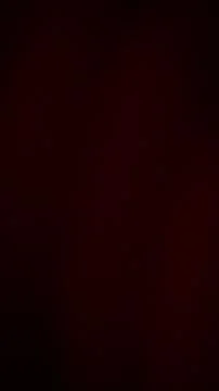 Abstract grainy dark red gradient background with deep maroon and black noi.. Stock Illustration