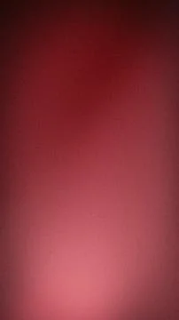 Abstract grainy gradient background with deep red maroon and soft rose pink.. Stock Photos