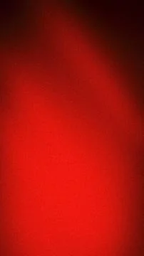 Abstract grainy gradient background featuring intense red, scarlet, and dar.. Stock Photos