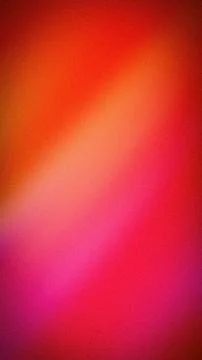 Abstract grainy gradient background with vibrant red, orange, and pink tone.. Stock Photos