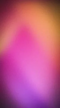 Abstract grainy gradient background with vibrant pink, orange, and purple t.. Stock Photos