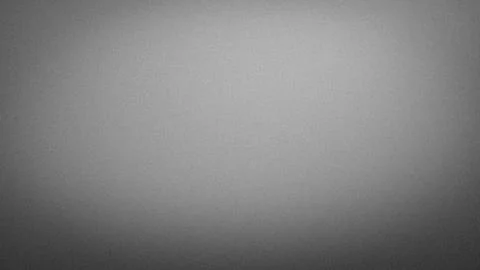 Abstract grainy gray gradient background with black shade 4K tech blur grun.. Stock Photos
