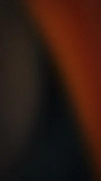 Abstract grainy vertical background with black orange and dark gray gradien.. 스톡 사진