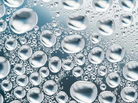 Abstract gray background with large and small spherical convex drops of wat.. Stock Photos