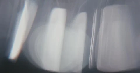 Abstract gray background with moving lens flares and refractions. Stock Footage 336269285