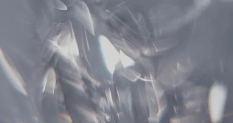 Abstract gray background with moving lens flares and refractions. Stock Footage 336269309