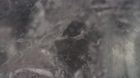 Abstract gray bubbling ice macro texture background Video stock 130944628