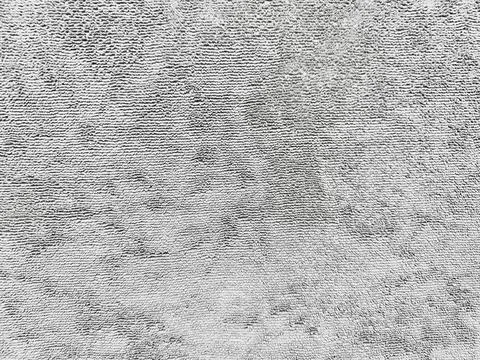 Abstract gray fluffy texture surface with wavy fibrous patterns evoking ser.. Stock Photos