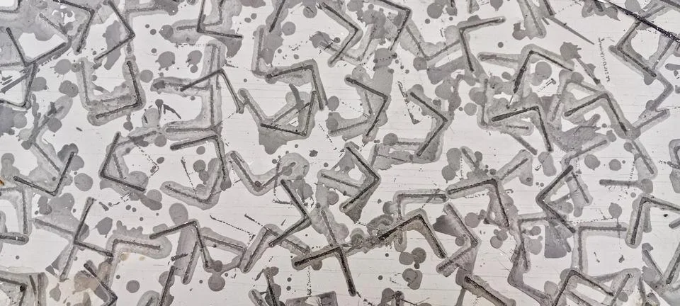 Abstract gray geometric pattern with paint splatters Stock Photos