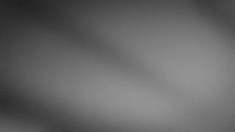 Abstract gray gradient grainy background in 4K quality texture for tech blu.. Stock Photos