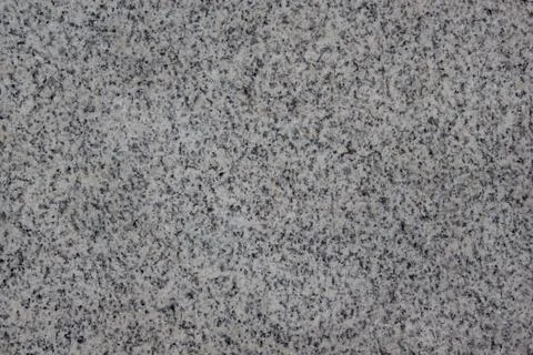 Abstract gray texture with different holes. Sandstone. Stone wall. Stock Photos
