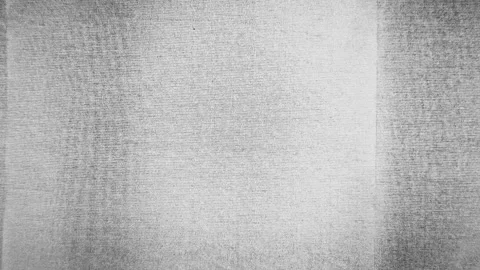 Abstract grayscale fabric texture with soft vignette and woven grain for Stock Footage 327130900