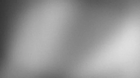 Abstract grayscale gradient background with grainy texture in 4K resolution.. Stock Photos