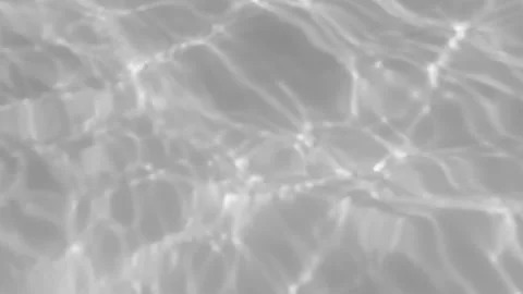 Abstract grayscale water reflections shimmering across swimming pool surface. Stock Footage 339620868