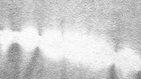 Abstract grayscale wavy cloud formation drifting across textured fuzzy surf.. Stock Photos
