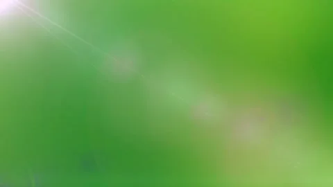 Abstract green background featuring soft glowing lens flare light effects for Stockbeeldmateriaal 343847448
