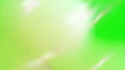 Abstract green background featuring vintage film grain texture with soft Stock Footage 345216419