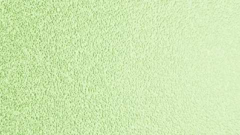 Abstract green background with tiny morphing bubbles, seamless looping (FULL HD) Stockbeeldmateriaal 98361690