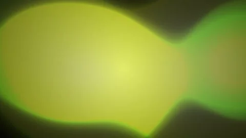 Abstract green bokeh light leak lens flare effect moving over dark background Stock Footage 346341958