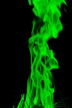 Abstract green  Fire flames on dark background. Stock Photos
