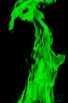 Abstract green  Fire flames on dark background. Stock Photos
