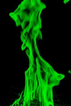 Abstract green  Fire flames on dark background. Stock Photos
