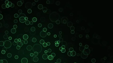 Abstract green glowing ring particle animation on a dark black background Stock Footage 340265619