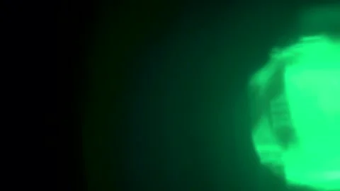 Abstract Green Light Effect in Darkness Stock Footage 325454009