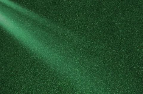 Abstract Green Light Rays on Concrete Background. Vibrant Glowing Light Textu Stock Photos