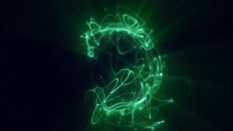 Abstract green light scribble forming energetic glowing trails on dark back.. Video stock 327328191