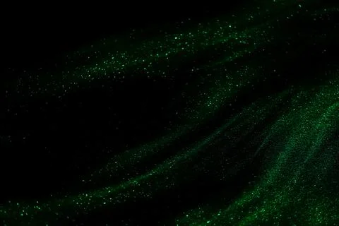 Abstract green speed camera motion background over glowing lights with spar.. Stock Photos