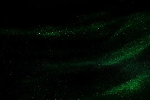 Abstract green speed camera motion background over glowing lights with sparkl Stock Photos