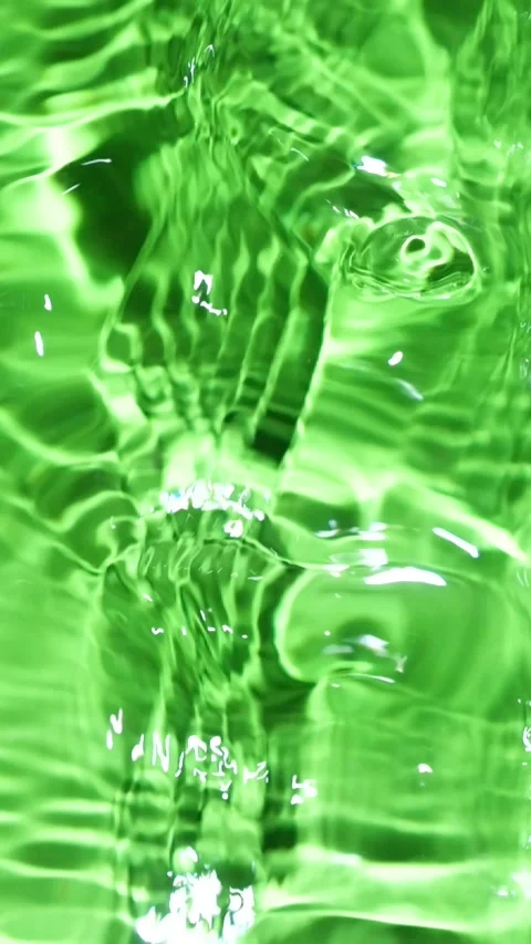 Abstract green water surface background with gentle waves and copy space in slow Stock Footage 344797630