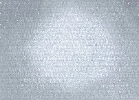 Abstract grey background with a light flash in the center and dots Stock Photos