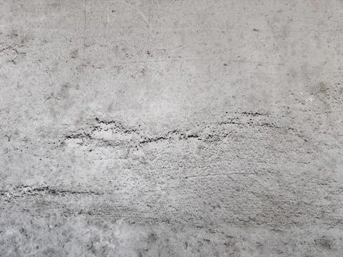 Abstract grey concrete wall texture with scratched and weathered surface, g.. 库存照片